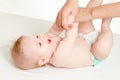 Mother massaging her baby girl Royalty Free Stock Photo