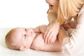 Mother massaging her baby Royalty Free Stock Photo