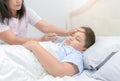 Mother measuring temperature of her ill kid. Royalty Free Stock Photo