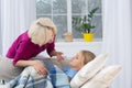 Mother measuring temperature of her sick child. Royalty Free Stock Photo