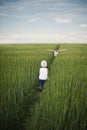 Mother meeting her baby in green field Royalty Free Stock Photo