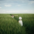 Mother meeting her daughter in spring green field Royalty Free Stock Photo