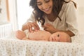 Mother moisturizing baby Royalty Free Stock Photo