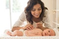 Mother moisturizing baby Royalty Free Stock Photo