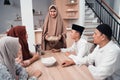 Mother muslim serving food for family