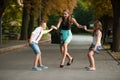 Mother with naughty son adn daughter on a walk in park