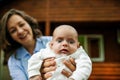 Mother And Newborn Baby with blue eyes Family Portrait, Mom Embracing New Born Kid Royalty Free Stock Photo