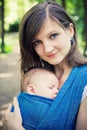 Mother with newborn baby in a sling Royalty Free Stock Photo