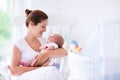 Mother and newborn baby in white nursery Royalty Free Stock Photo
