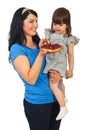Mother offering tart fruit to her daughter Royalty Free Stock Photo