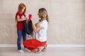 Mother packing daughter`s backpack for the first day of school Royalty Free Stock Photo