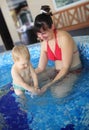 Mother play with her lovely child in jacuzzi