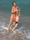 Mother play with son on beach