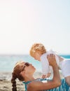 Mother playing with baby on beach Royalty Free Stock Photo