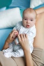 Mother playing with baby lying on bed Royalty Free Stock Photo