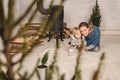 Mother playing with daughter near the retro fireplace