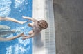 Mother playing with her baby at swimming pool indoor Royalty Free Stock Photo