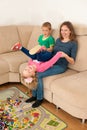 Mother is playing with her daughter in living room Royalty Free Stock Photo