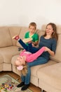 Mother is playing with her daughter in living room Royalty Free Stock Photo