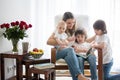 Mother, playing with her toddler boy and his older brother, read Royalty Free Stock Photo