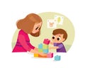 Mother playing with kid at home. Educational toys. Child playing designer cubes.