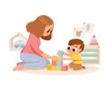 Mother playing with kid at home. Educational toys. Child playing designer cubes.