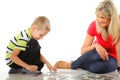 Mother playing puzzle together with her son Royalty Free Stock Photo