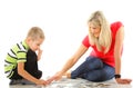 Mother playing puzzle together with her son Royalty Free Stock Photo