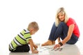 Mother playing puzzle together with her son Royalty Free Stock Photo