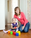 Mother plays with baby in home Royalty Free Stock Photo