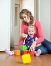 Mother plays with baby in home Royalty Free Stock Photo