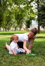 Mother plays with child with toy car Royalty Free Stock Photo