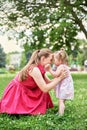 Mother plays with a small child on the street