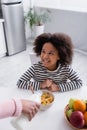 mother pouring milk into bowl with Royalty Free Stock Photo