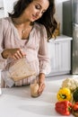 Mother pouring tasty smoothie in glass Royalty Free Stock Photo