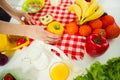 Mother preparing healthy and tasty lunch box for child Royalty Free Stock Photo