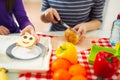 Mother preparing healthy and tasty lunch box for child Royalty Free Stock Photo