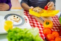 Mother preparing healthy and tasty lunch box for child Royalty Free Stock Photo