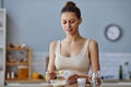 Mother Preparing Infant Formula in Kitchen Royalty Free Stock Photo