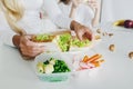 Mother preparing sandwich school lunch table close up Royalty Free Stock Photo