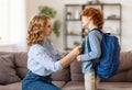 Mother preparing son for school studies Royalty Free Stock Photo