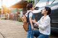 Mother preparing to send her children back to school at car in morning. Mom say Good bye before school start. Education and Back Royalty Free Stock Photo