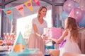 Kind woman smiling and giving birthday present to her daughter Royalty Free Stock Photo