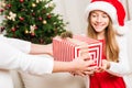 Mother presenting christmas gift for daughter Royalty Free Stock Photo