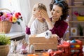 Mother Presenting Easter Bunny to Son Royalty Free Stock Photo