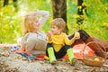 Mother pretty woman and little son relaxing forest picnic. Good day for spring picnic in nature. Having snack during
