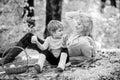 Mother pretty woman and little son relaxing forest picnic. Good day for spring picnic in nature. Having snack during