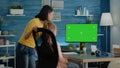 Mother and pupil doing homework with horizontal green screen Royalty Free Stock Photo