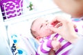 Mother putting a dummy in a baby's mouth Royalty Free Stock Photo
