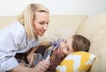 Mother putting son to sleep. Mother putting son to bed. Sweet sleeping child with lovely mom Royalty Free Stock Photo